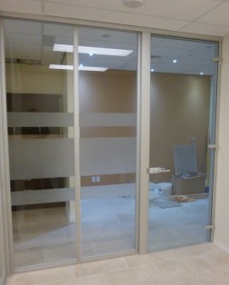 Floor to ceiling glass wall system